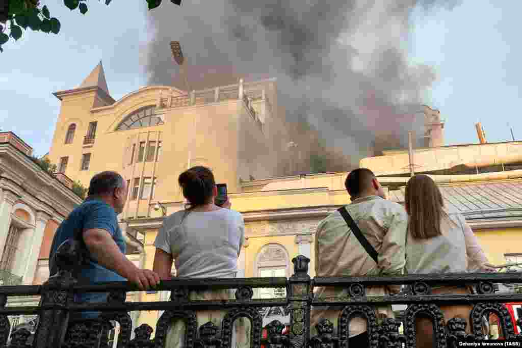 Smoke streams out of the building that houses Moscow's famous Cafe Pushkin on July 6. A fire reportedly broke out on the roof of the site. No casualties were reported. 