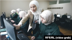 Girls study at the Sayida Khadijah madrasah in Osh Province, Kyrgyzstan.