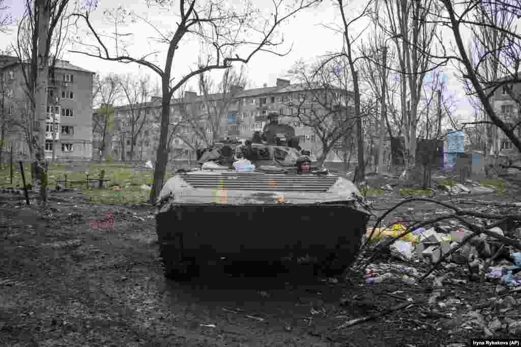 Ukrainian soldiers driving an armored personnel carrier in Bakhmut on April 12. A report published on the same day this photo was taken describes Ukrainian forces defending a “shrinking half-circle of ruins in a western neighborhood of Bakhmut." However a map from the same New York Times report shows a significant portion of the center of the city still under Ukrainian control. 