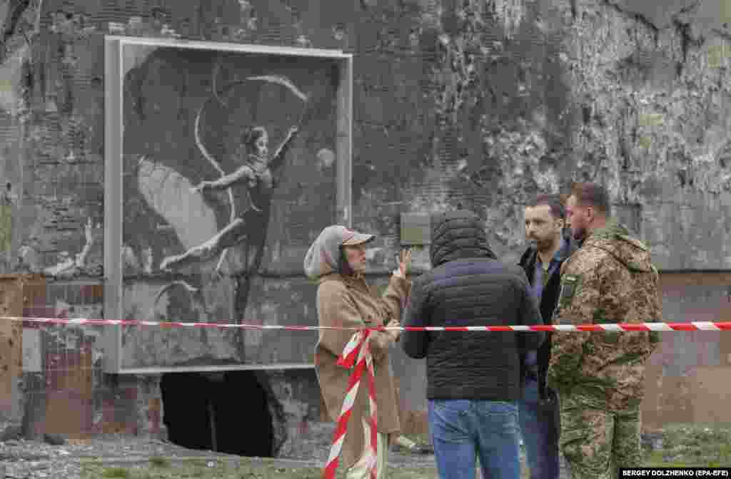 A mural by the elusive British artist Banksy -- showing an injured gymnast in a neck collar performing a ribbon routine -- painted on one of Irpin's shattered residential buildings will be preserved. City officials last year made Banksy an honorary citizen for "drawing the world community's attention to the scale of the destruction of Irpin."