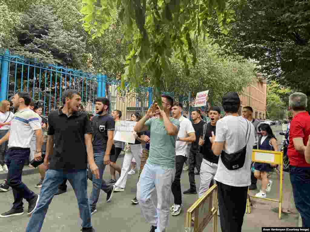 Protesters march near the Yerevan headquarters of the United Nations in Armenia on July 24. One woman holds a sign calling for the UN to "immediately send humanitarian cargo" to Nagorno-Karabakh. 