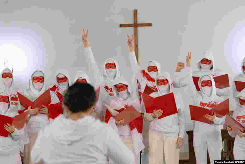 Exiled Belarusian singers calling themselves the Free Choir&nbsp;-- masked to protect their identities -- perform following the march.&nbsp; Before going into exile, the Free Choir sang in support of anti-government demonstrators and against the violent crackdown on protests in Belarus following the contested 2020 presidential vote. They now perform in European capitals like Warsaw and Berlin to draw international attention to the plight of Belarusians living under Lukashenka&#39;s authoritarian rule.