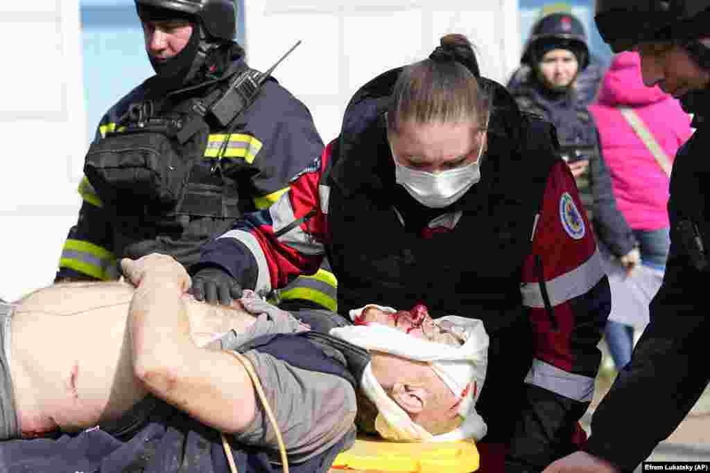 Medics evacuate a wounded man at the site. 
