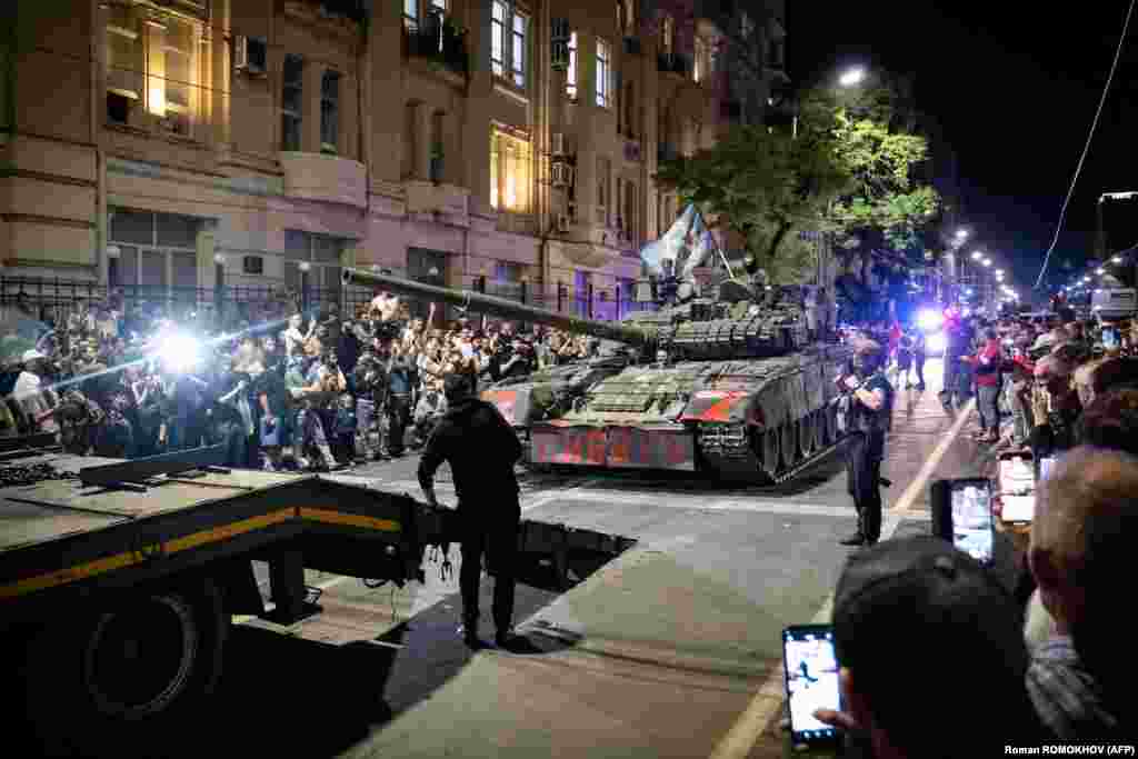 Members of the Wagner Group prepare to pull out from the headquarters of the Southern Military District in Rostov-on-Don to return to their base late on June 24. Russia’s Federal Security Service announced a criminal case against Prigozhin for “incitement to armed rebellion” after he vowed to lead a “march of justice” against top officials in Russia’s Defense Ministry. 
