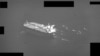 A U.S. Navy handout screenshot of a video shows fast-attack craft from the IRGC swarming Panamanian-flagged oil tanker Niovi as it transits the Strait of Hormuz on May 3.