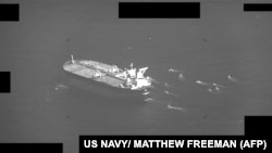A U.S. Navy handout screenshot of a video shows fast-attack craft from the IRGC swarming Panamanian-flagged oil tanker Niovi as it transits the Strait of Hormuz on May 3.