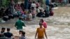 People cooling off on a sweltering afternoon in Lahore on May 19. 