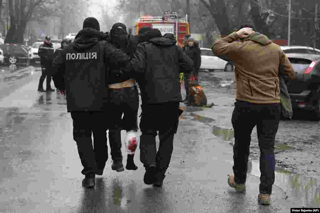 An injured man is escorted from the scene. Nearly 25 months into Russia&#39;s full-scale invasion of Ukraine, Moscow repeatedly denies it is targeting civilians.