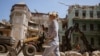 A woman walks past damaged historic buildings in the center of the Ukrainian city of Odesa, which UNESCO has listed as a World Heritage site. (file photo)