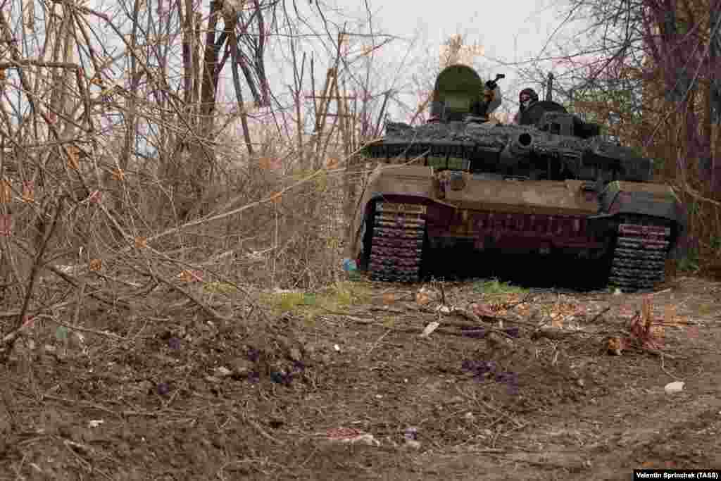 A Russian T-90MS tank emerging from broken trees in Bakhmut on April 10. On the Russian side of the battle for Bakhmut, access is effectively impossible for reporters not directly employed by the Kremlin or championing the Russian invasion. This photo was made by Valentin Sprinchak, a photographer with Russia’s TASS news agency.