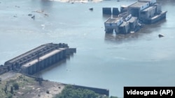 An aerial photograph of the destroyed Kakhovka dam in Ukraine in June. 