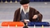Iran's Supreme Leader Ayatollah Ali Khamenei casts his ballots at a polling station in Tehran on March 1.