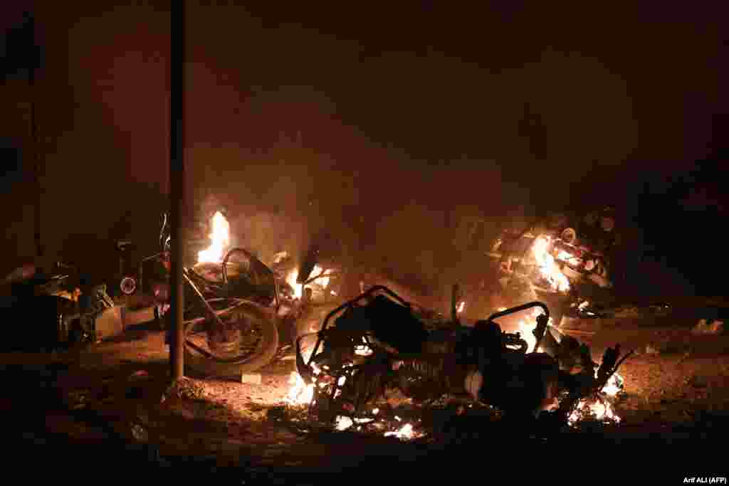 Vehicles burned late into the night after the clashes. Khan has skipped indictment hearings three times in the case in which he is accused of concealing details of the gifts in his asset declarations. 