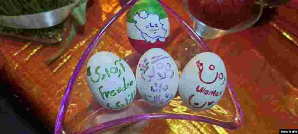 A selection of this year's Norouz eggs (Haftseen) feature the anti-government slogan "Woman, life, freedom" in Iran. Iran has been rocked by mass protests for the past six months following the death of a young woman in police custody. Though Norouz is associated with being Persian and Iranian, the holiday is celebrated throughout Western Asia, Central Asia, the Caucasus, the Black Sea Basin, the Balkans, and South Asia.