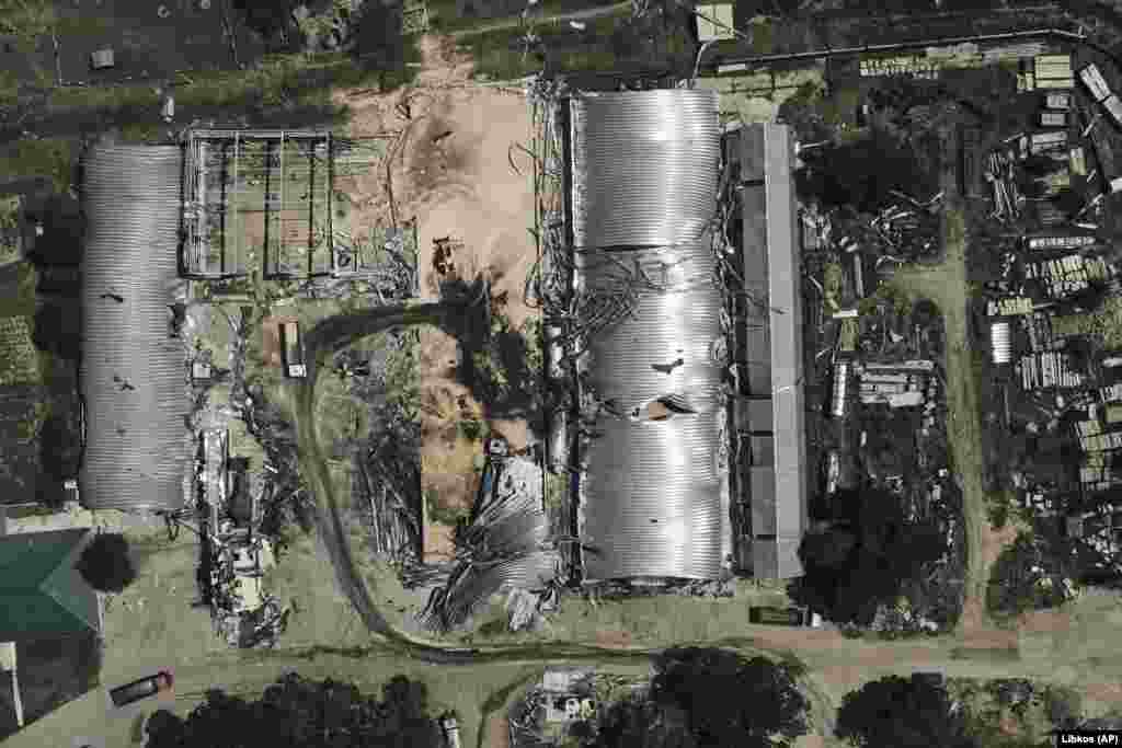 An aerial view of burnt-out storage facilities following the attack in Odesa. The missile barrage injured two people, damaged equipment, and destroyed 100 metric tons of peas and 20 metric tons of barley, regional Governor Oleh Kiper said.