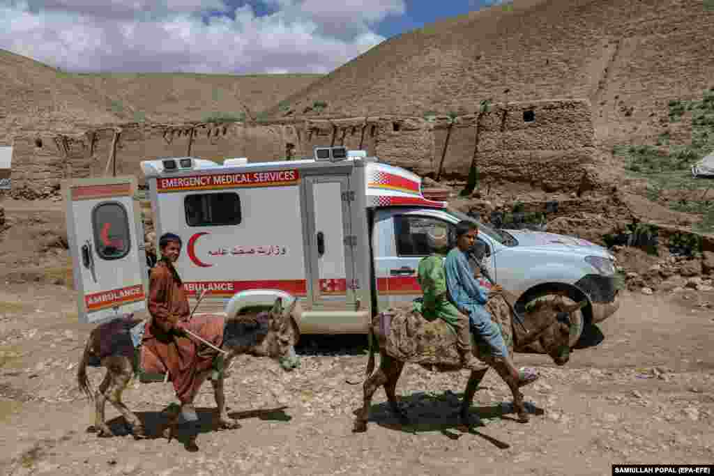 An ambulance reaches flooded areas near the village of Shirjalal in Baghlan. The destruction was most severe in Baghlan Province, where "unprecedented rainfall" has damaged or destroyed thousands of homes since May 10.