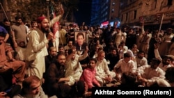 Supporters of former Pakistani Prime Minister Imran Khan chant slogans as they protest his possible arrest, on March 14 in Karachi, Pakistan.