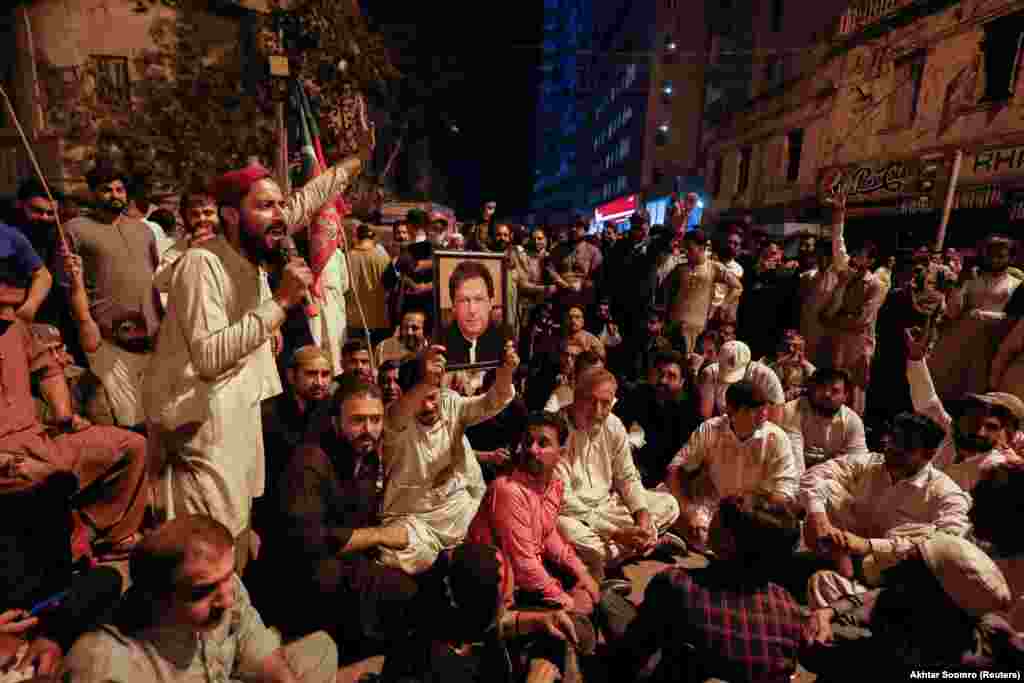 PTI supporters chant anti-government slogans in Lahore on March 14. 