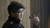 Quandyq Bishimbaev is accused of viciously beating his wife to death in a restaurant in November.