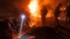 Ukrainian first responders work at the scene of an overnight drone attack in Kharkiv on April 4. Air defenses are an increasing priority for Kyiv.