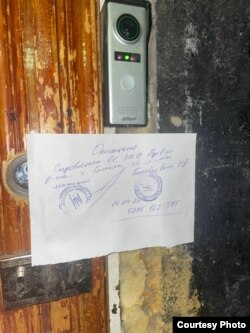 A sign marks the premises of Ailan Bar as sealed by the police.