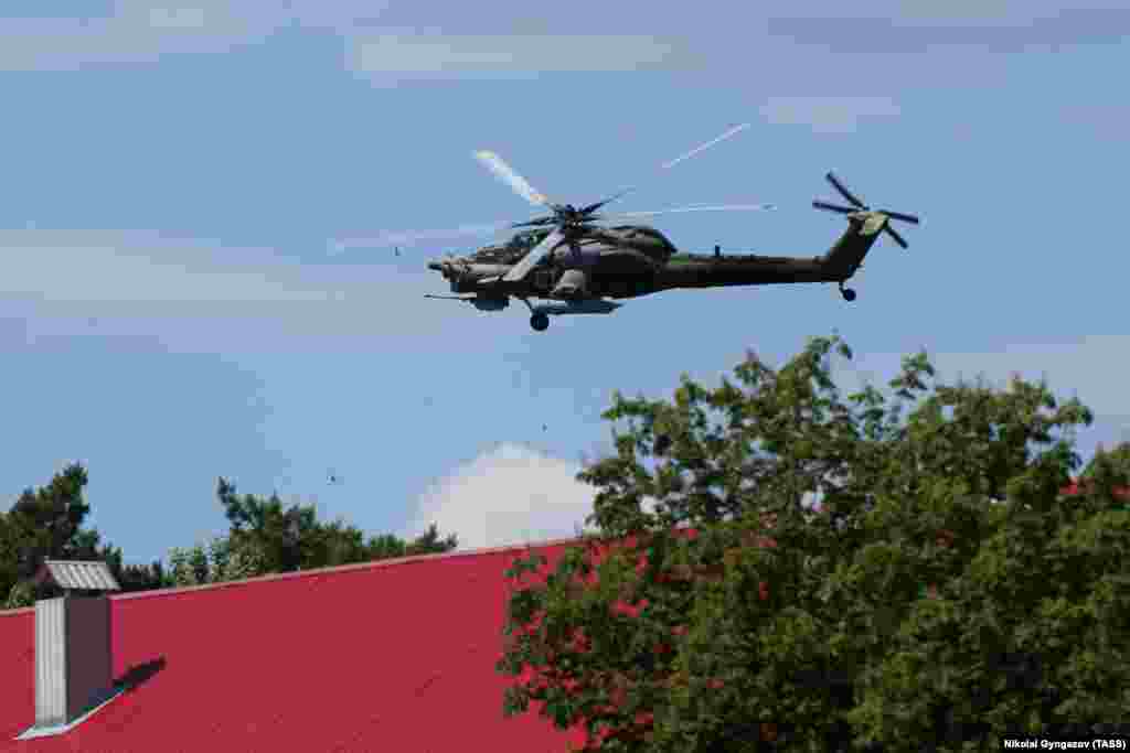 A Russian military helicopter is seen above Shebekino on June 6. Both the Russian military and anti-Kremlin Russian militants have made conflicting claims about who controls various Russian towns near the border with Ukraine. 