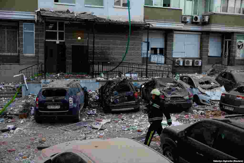 A firefighter walks near cars damaged during the Russian drone strike. Russia has intensified missile and drone strikes on Ukraine after a lull of nearly two months, targeting military facilities and supplies with waves of attacks several times a week. &nbsp;