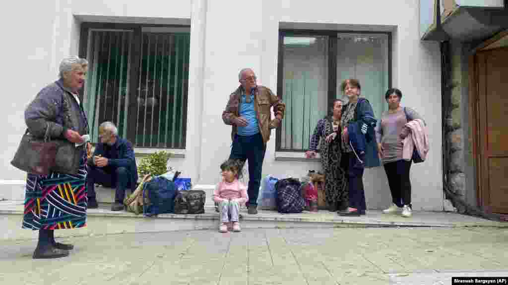 Local residents gather near a local government building after reports of shootings in Stepanakert. Separatists running the self-styled Republic of Artsakh -- as Nagorno-Karabakh is known by Armenians -- said they had been forced to agree to Azerbaijan's terms -- relayed by Russian peacekeepers -- after Baku's army broke through their lines and seized strategic locations. Azerbaijan had said it could no longer tolerate a situation it regarded as a threat to its security and territorial sovereignty.