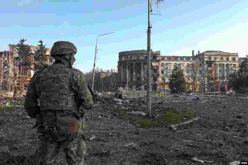 A pro-Russian soldier in Bakhmut’s central square. The photo was made in front of the city’s administration building (out of frame on left) during an April 10 visit by Denis Pushilin, the Russian-installed leader of Ukraine's Donetsk region. Yevgeny Prigozhin, the head of Russia’s Wagner mercenary group, claimed on April 11 that his forces controlled more than 80 percent of the city. Ukrainian officials have denied the assertion.
