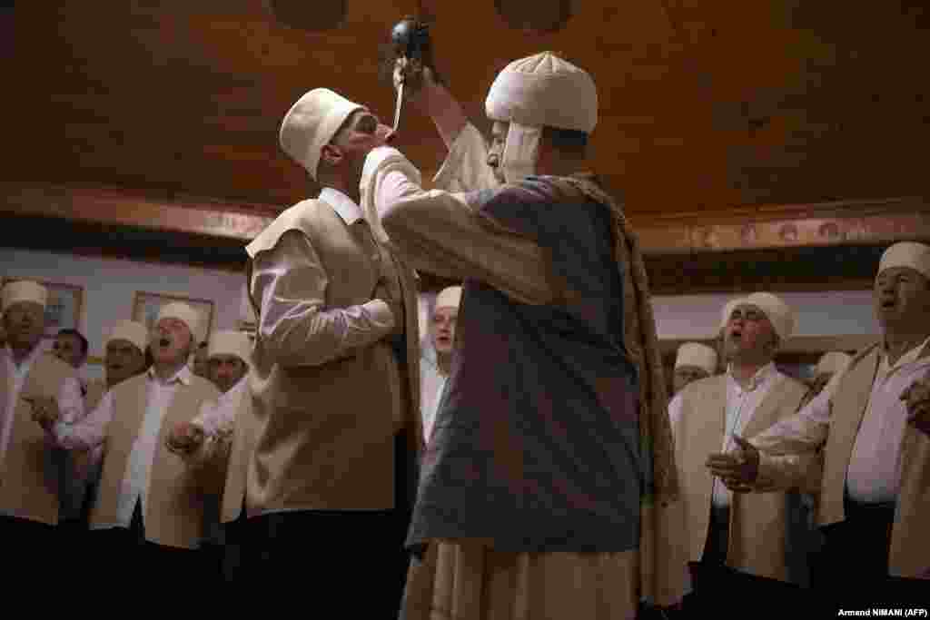 As his fellow Dervishes chant and sway to the hypnotic rhythm of prayer until reaching a trance-like state, a man has his neck pierced with long needles in the town of Gjakova, Kosovo. Considered a mystic sect by fellow Muslims in Kosovo and Albania, the dozens of Sufi Dervishes from the Kadiri order celebrate the centuries-old traditions of the spring equinox, known to them as Sultan Nevruz.