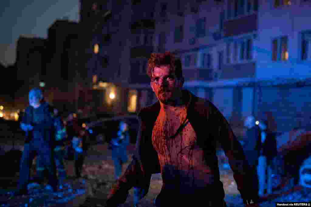 An injured man stands next to an apartment building that was damaged during the massive Russian drone strike on Kyiv. &quot;One person died. In total, four victims were hospitalized in the Holosiyivskiy district. Medics provided help on the spot,&quot;&nbsp;Klitschko wrote, adding that 20 people were evacuated.