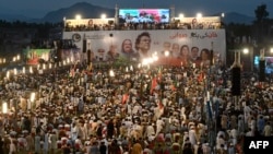 Supporters of former Prime Minister Imran Khan and his Pakistan Tehrik-e Insaf party rally on August 5 to mark the first anniversary of Khan's imprisonment.