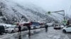 RUSSIA - Cars and heavy trucks are lined up near the Upper Lars border crossing with Georgia, November 21, 2023.