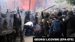 Soldiers of NATO-led international peacekeeping Kosovo Force (KFOR) scuffle with ethnic Serbs in front of the building of the municipality in Zvecan, Kosovo, on May 29, 2023. 