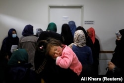 Women line up outside a doctor's room at a hospital in Bamiyan.
