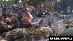 Protesters were also seen throwing stones and bottles at KFOR troops. NATO officials said about two dozen KFOR soldiers were injured in the unrest.
