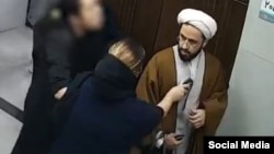 The video in question shows a woman without the mandatory hijab holding her baby, leading to widespread public and online outrage. 