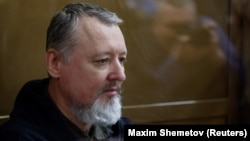 Igor Girkin sits inside the glass-walled enclosure for defendants before a court hearing in Moscow on January 25.