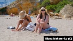 "You have to find a way to relax, " said Ksenia Kyryushyna (right), who came to the beach in Odesa for a vacation in August.