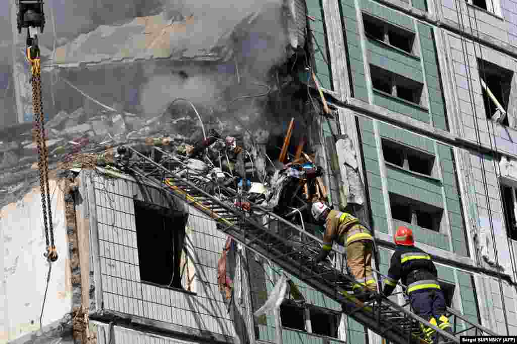 Firefighters at a residential building in Uman. The missiles were fired from aircraft operating in the Caspian Sea region, according to Ukrainian Armed Forces Commander in Chief Valeriy Zaluzhniy. &nbsp;