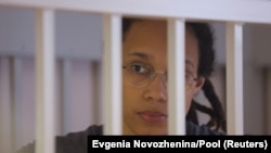 U.S. basketball player Brittney Griner sits inside a defendants' cage as she is given a nine-year prison sentence in Moscow on August 4.