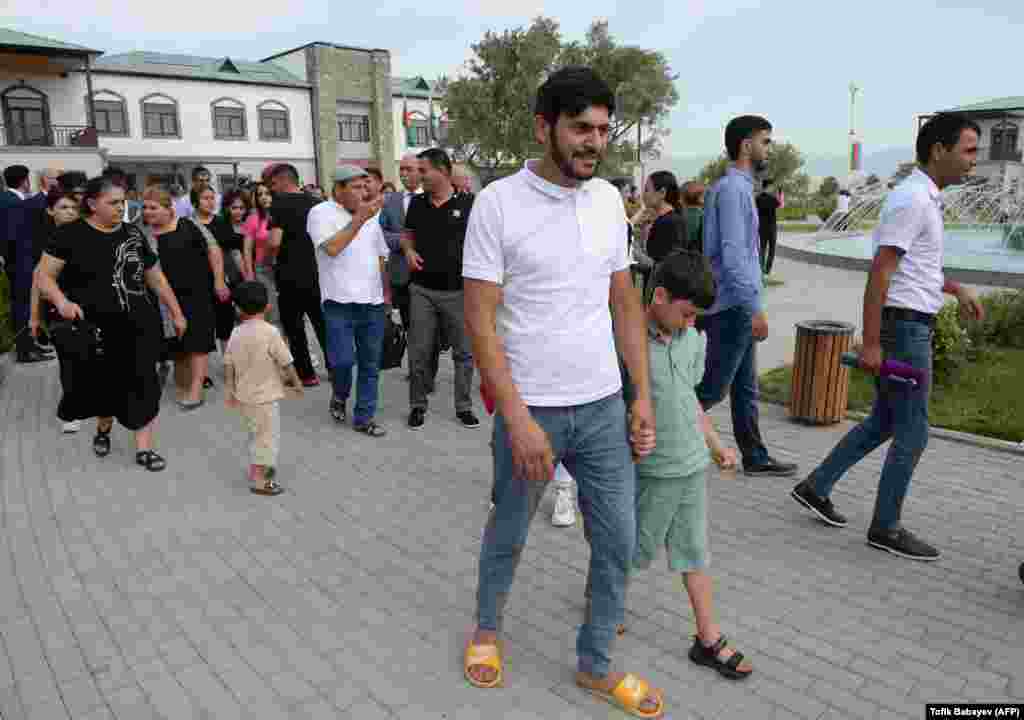 A group of internally-displaced families visit Agali, in Azerbaijan’s southwestern region of Zangilan on July 19. The province was held by ethnic Armenians from 1993 until Baku launched a war to reclaim territory in and around Nagorno-Karabakh in September 2020. 