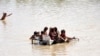 People affected by flooding wait for relief in in Pakistan's Sindh Province on August 28. 