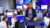 One on-screen question: "Putin, you really think that people believe this circus, with planted questions?" 