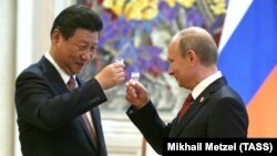 Chinese President Xi Jinping (left) and his Russia counterpart, Vladimir Putin (file photo)