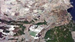 Ova satelitska snimka prikazuje polja u slivu rijeke Irpin sjeverozapadno od Kijeva prije poplave.