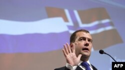 Russian President Dmitry Medvedev speaks at a joint business seminar in Oslo on April 26.