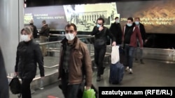 Armenian citizens wearing face masks to protect against the coronavirus returning from Iran last week.