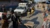 Pakistani police stand guard along a road in Bannu. (file photo)
