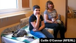 Nazar Ismailov with his mother, Olha, in their apartment in the Czech town of Usti nad Labem, where they have settled since fleeing Kharkiv after Russia invaded Ukraine. 